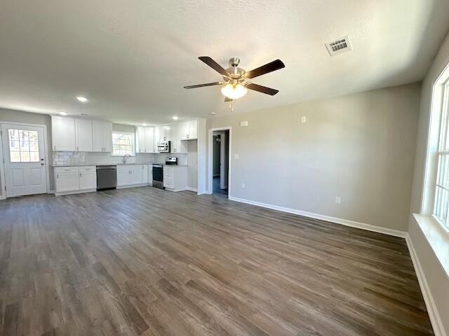 111 Matthews St, Wrens, GA 30833 - unfurnished living room featuring dark wood-style flooring, ceiling fan, and recessed lighting