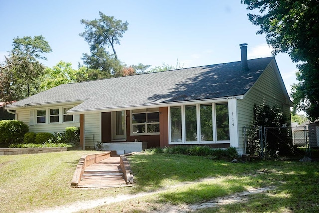 114 Bordeaux St, North Augusta, SC 29841 - rear view of house with roof with shingles and a lawn