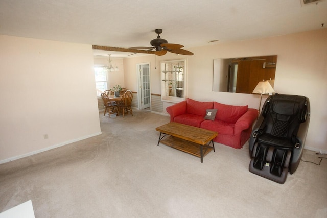 114 Bordeaux St, North Augusta, SC 29841 - living room with carpet flooring, baseboards, a ceiling fan, and a chandelier