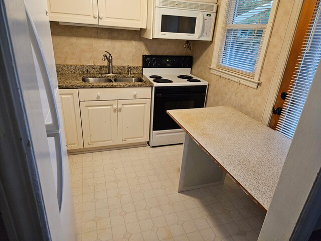 114 Bordeaux St, North Augusta, SC 29841 - carpeted living room with a wood stove, a ceiling fan, and a decorative wall