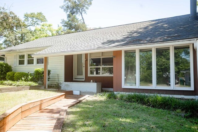 114 Bordeaux St, North Augusta, SC 29841 - rear view of property featuring roof with shingles and a yard