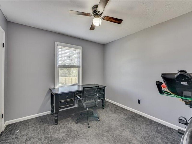 home office featuring baseboards, ceiling fan, and carpet flooring