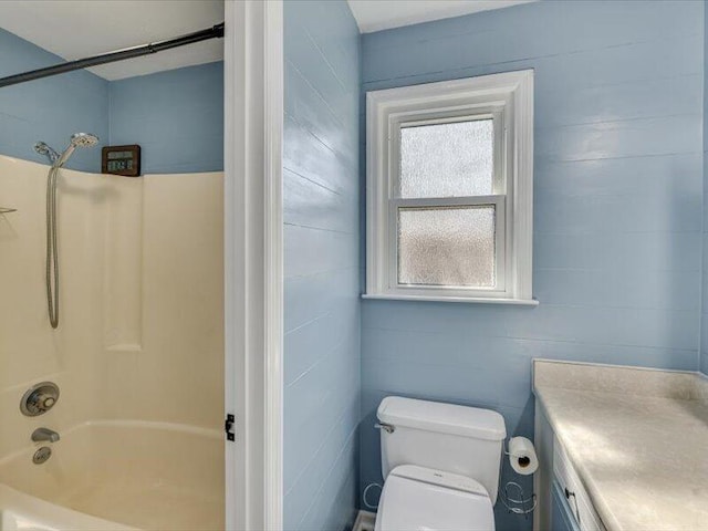 full bathroom with tub / shower combination, toilet, and vanity