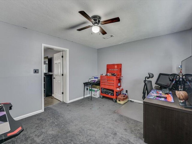 recreation room featuring visible vents, a textured ceiling, carpet floors, baseboards, and ceiling fan