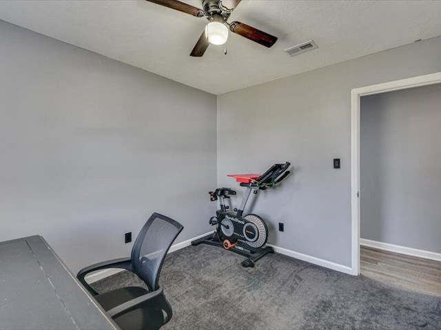 workout room with visible vents, ceiling fan, baseboards, and carpet floors