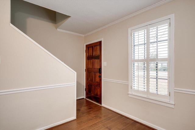 empty room with wood-type flooring and ornamental molding