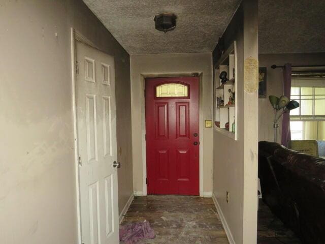 interior space with a textured ceiling