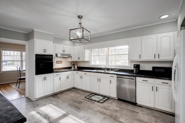 kitchen with black oven, stainless steel dishwasher, a sink, a chandelier, and freestanding refrigerator