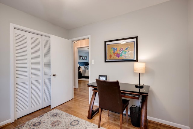 office with wood finished floors and baseboards