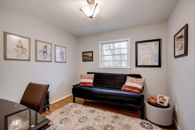 office area with wood finished floors and baseboards