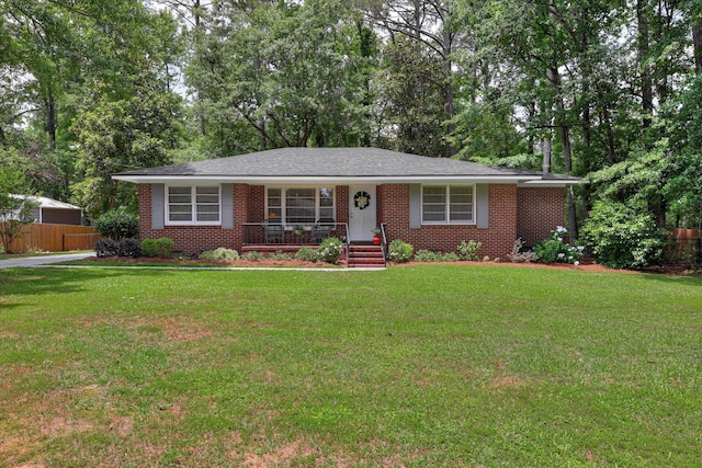 ranch-style house featuring brick siding and covered porch