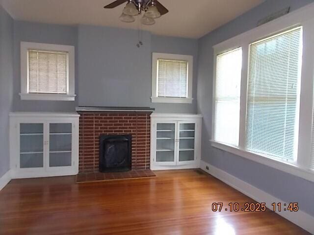 1420 Heath St, Augusta, GA 30904 - unfurnished living room with a ceiling fan, wood finished floors, and a fireplace