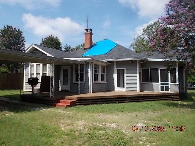 1420 Heath St, Augusta, GA 30904 - back of property featuring a chimney, a wooden deck, and a yard