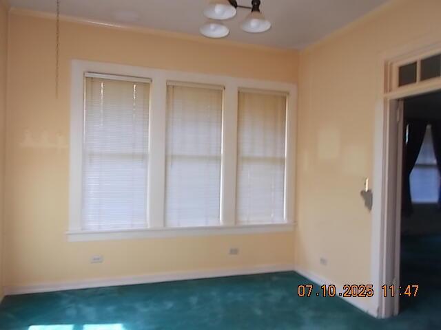 1420 Heath St, Augusta, GA 30904 - carpeted spare room with a chandelier and baseboards
