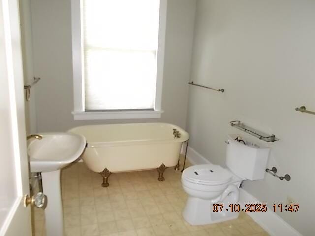 1420 Heath St, Augusta, GA 30904 - bathroom featuring a freestanding tub and toilet