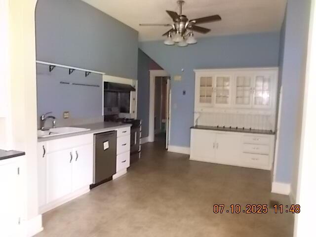 1420 Heath St, Augusta, GA 30904 - kitchen featuring dishwasher, ceiling fan, white cabinetry, and glass insert cabinets