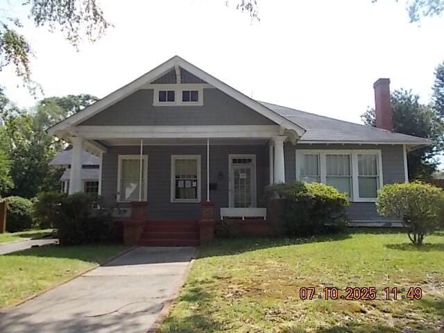 1420 Heath St, Augusta, GA 30904 - bungalow with a chimney, a front lawn, and a porch