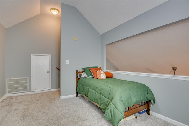 bedroom with carpet floors, lofted ceiling, visible vents, and baseboards