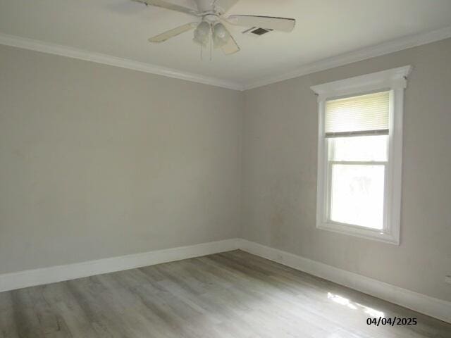 1937 Haynie Dr, Augusta, GA 30904 - spare room with visible vents, baseboards, ornamental molding, ceiling fan, and wood finished floors