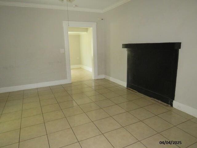 1937 Haynie Dr, Augusta, GA 30904 - unfurnished living room with a fireplace, light tile patterned floors, baseboards, and crown molding