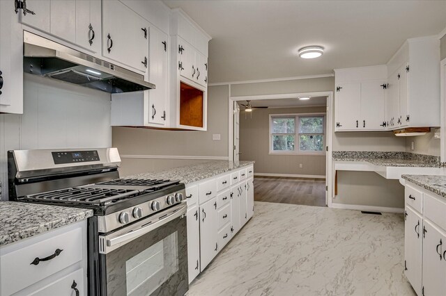 1116 Northwood Rd, Augusta, GA 30909 - kitchen featuring stainless steel range with gas stovetop, under cabinet range hood, white cabinetry, ceiling fan, and ornamental molding