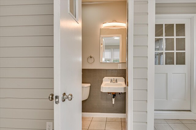 1116 Northwood Rd, Augusta, GA 30909 - half bathroom with tile walls, tile patterned floors, and a wainscoted wall
