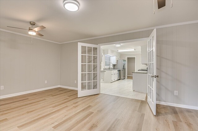 1116 Northwood Rd, Augusta, GA 30909 - spare room with french doors, light wood-style flooring, a ceiling fan, and crown molding
