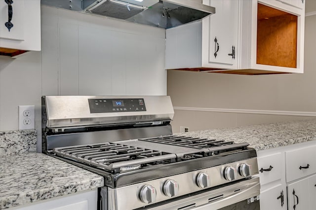 1116 Northwood Rd, Augusta, GA 30909 - kitchen featuring gas stove, range hood, and white cabinets