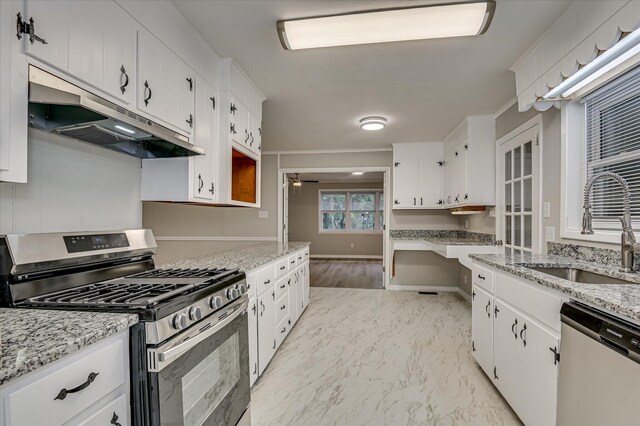1116 Northwood Rd, Augusta, GA 30909 - kitchen featuring stainless steel appliances, under cabinet range hood, and white cabinets