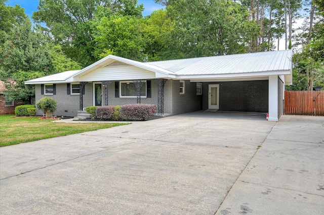 1116 Northwood Rd, Augusta, GA 30909 - ranch-style home featuring concrete driveway, an attached carport, brick siding, and a metal roof