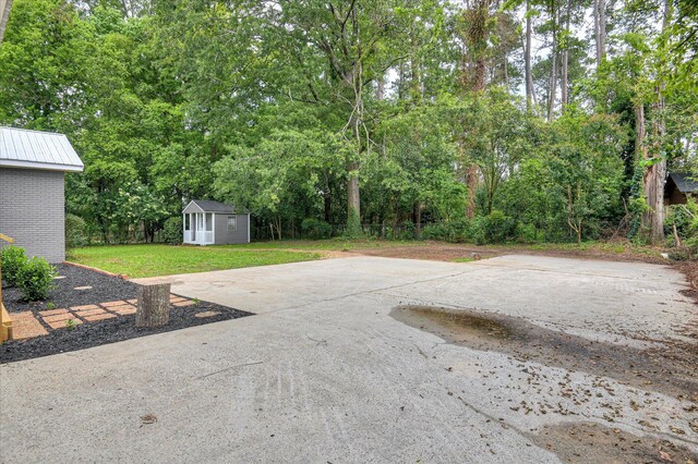 1116 Northwood Rd, Augusta, GA 30909 - view of patio with an outbuilding and view of scattered trees