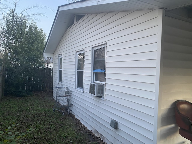 view of side of property with cooling unit