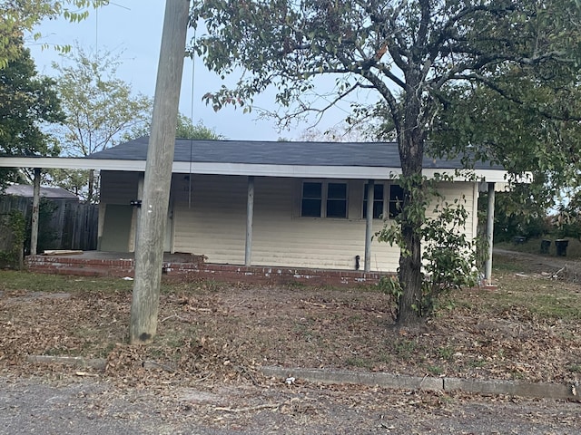 view of home's exterior with a carport