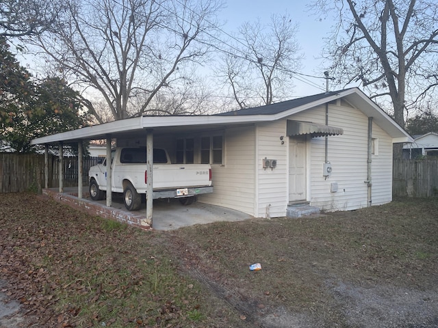 exterior space featuring a carport