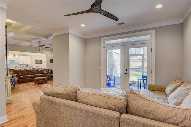 living room with coffered ceiling, french doors, beam ceiling, light hardwood / wood-style flooring, and ceiling fan