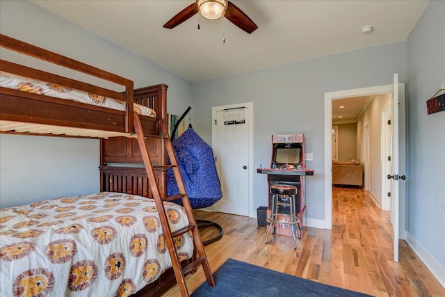 bedroom featuring ceiling fan and light hardwood / wood-style flooring