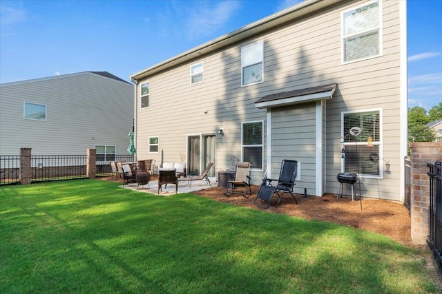 back of property with a lawn and a patio