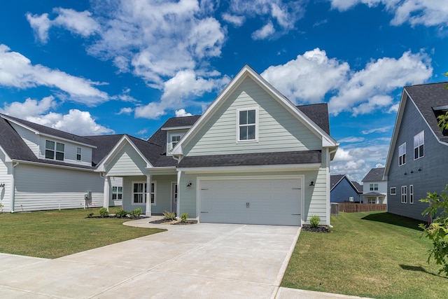 view of front of house with a garage and a front lawn