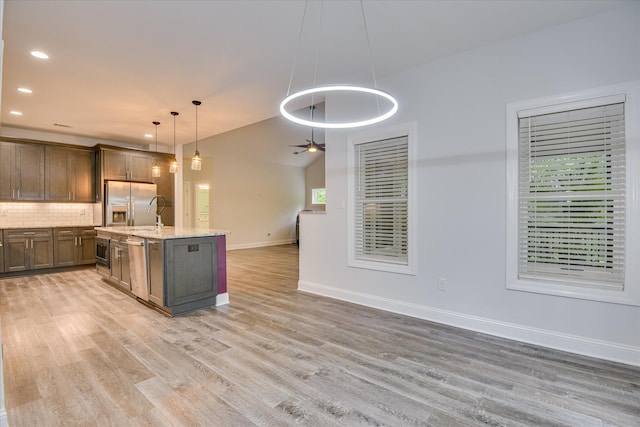 170 Grandview Dr, Mccormick, SC 29835 - kitchen with stainless steel appliances, light wood finished floors, tasteful backsplash, baseboards, and open floor plan