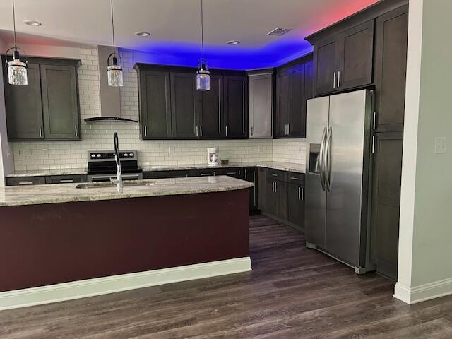 170 Grandview Dr, Mccormick, SC 29835 - kitchen featuring stainless steel appliances, wall chimney range hood, a sink, light stone countertops, and decorative backsplash