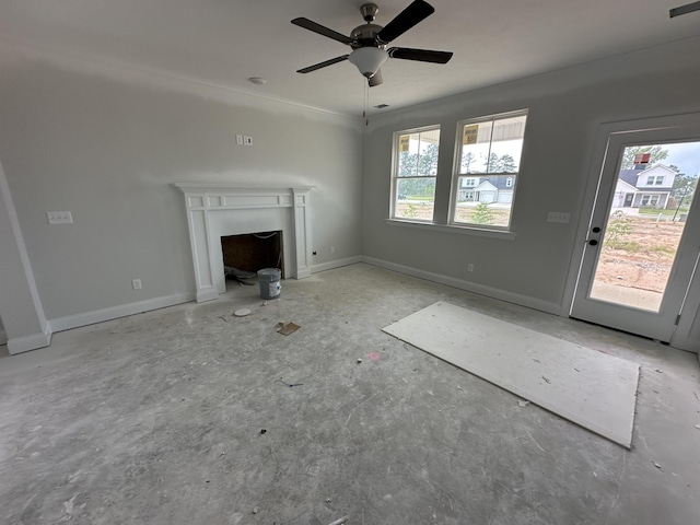 32 Coslett Dr, North Augusta, SC 29860 - unfurnished living room featuring a ceiling fan, a fireplace, and baseboards