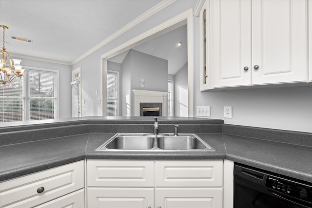 kitchen with dishwasher, sink, white cabinets, hanging light fixtures, and ornamental molding