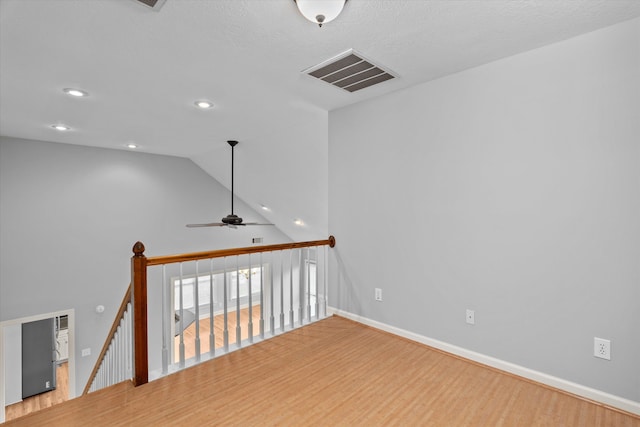 interior space featuring ceiling fan, hardwood / wood-style floors, and high vaulted ceiling