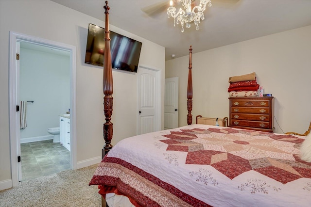 carpeted bedroom featuring ceiling fan and connected bathroom