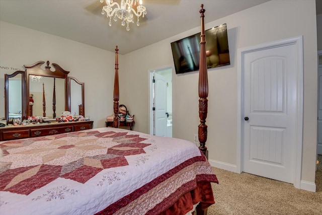 bedroom featuring a chandelier and light colored carpet