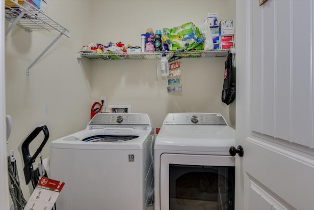 washroom with washing machine and dryer