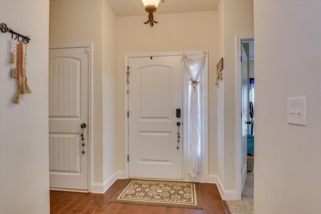 foyer with dark hardwood / wood-style floors