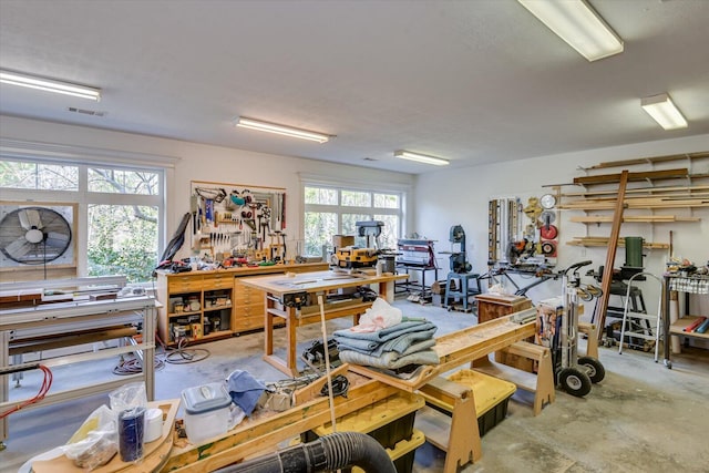 interior space with visible vents and a workshop area