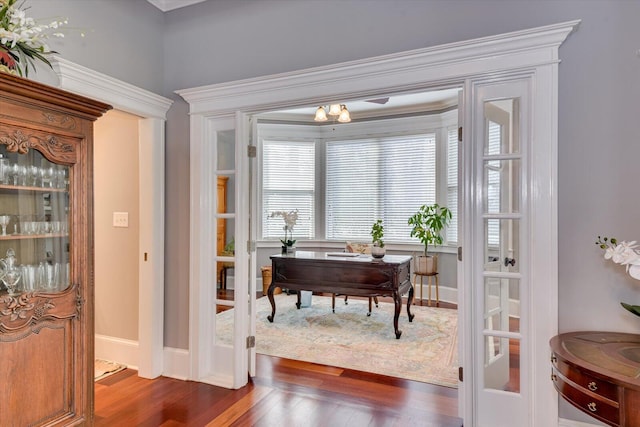 office space with dark wood-type flooring and baseboards