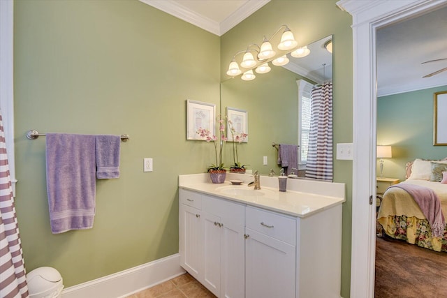 full bath featuring vanity, baseboards, crown molding, and ensuite bathroom